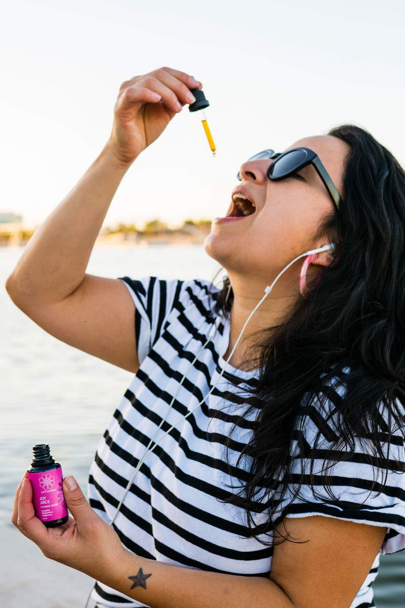 Woman taking Joy Juice Elixir while Roller Skating